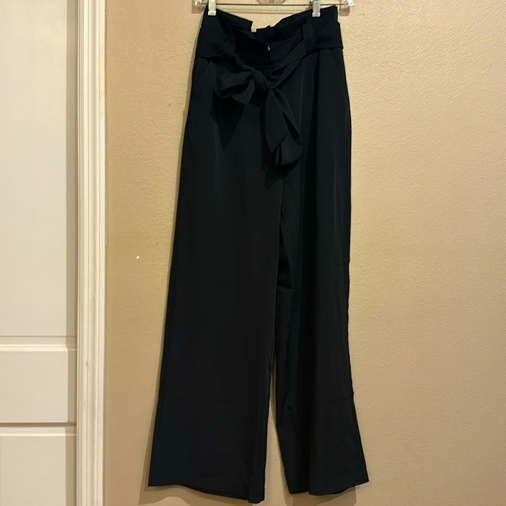 Black wide leg clip and zipper closure with removable belt. Size S. Never worn.